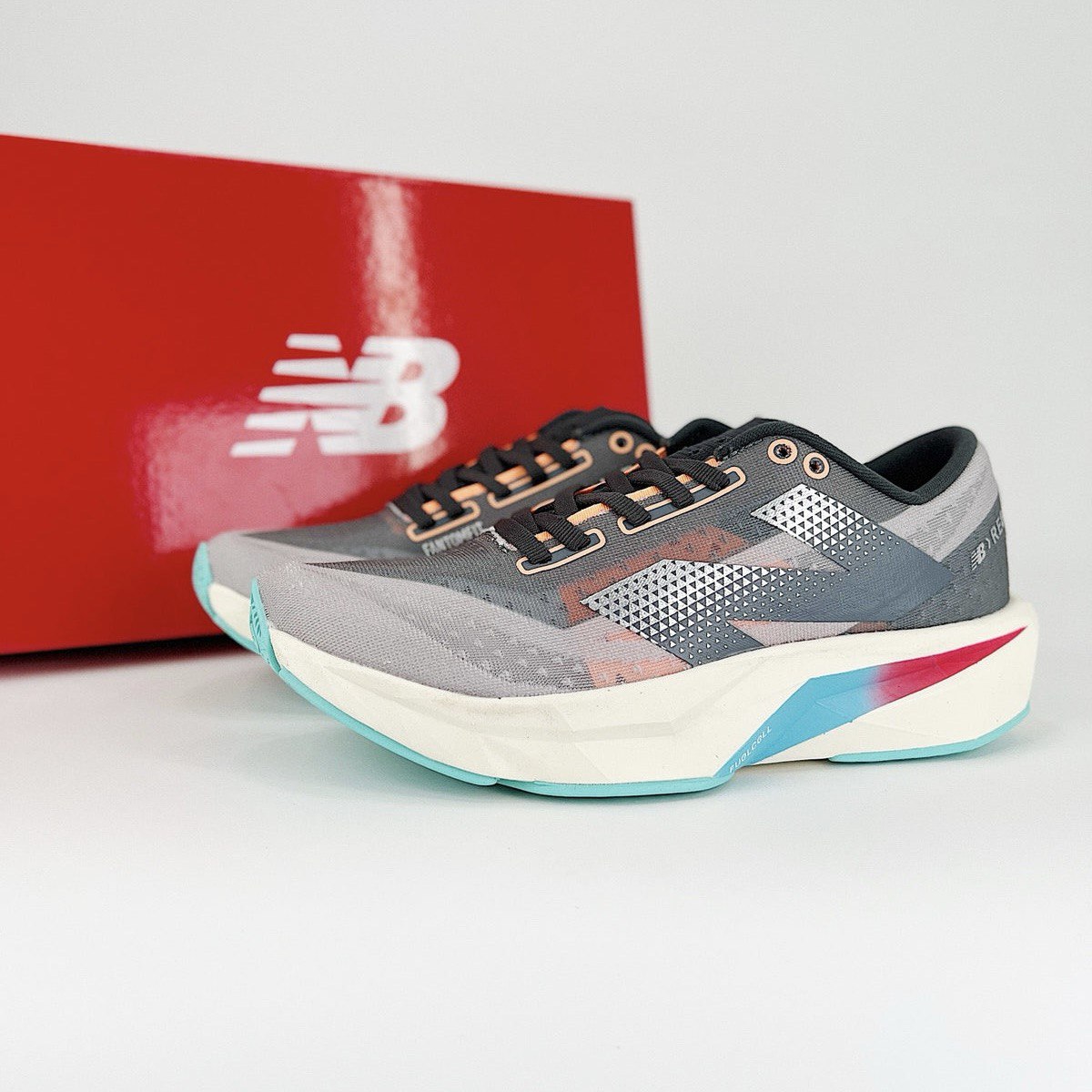 New Balance FuelCell Rebel V4 - Cinza/Azul